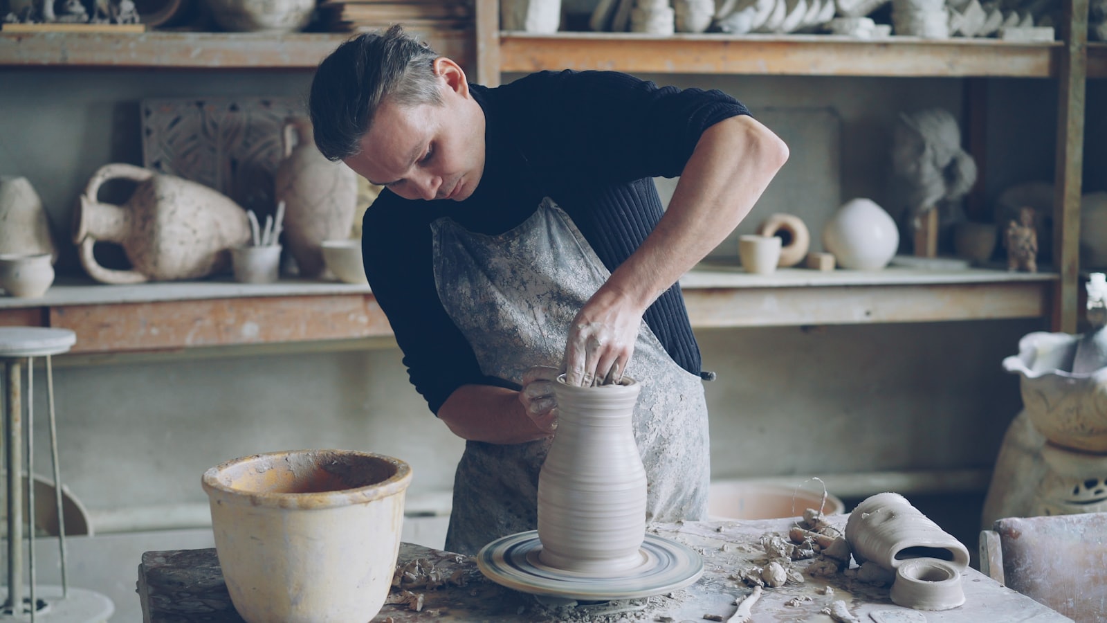 A maker at work in a bright pottery studio